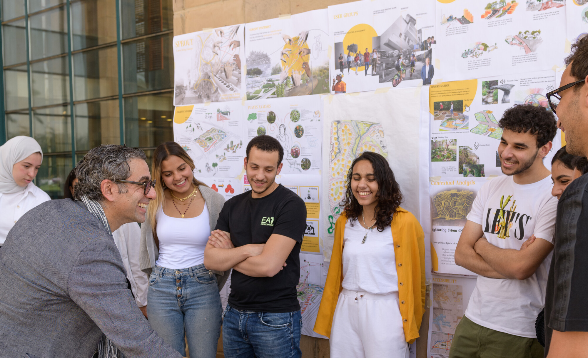 architect professor explaining to students and smiling faces