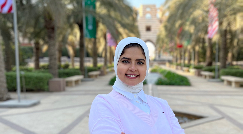 Shimaa Heikal (MSc '22), PhD candidate posing in the AUC garden