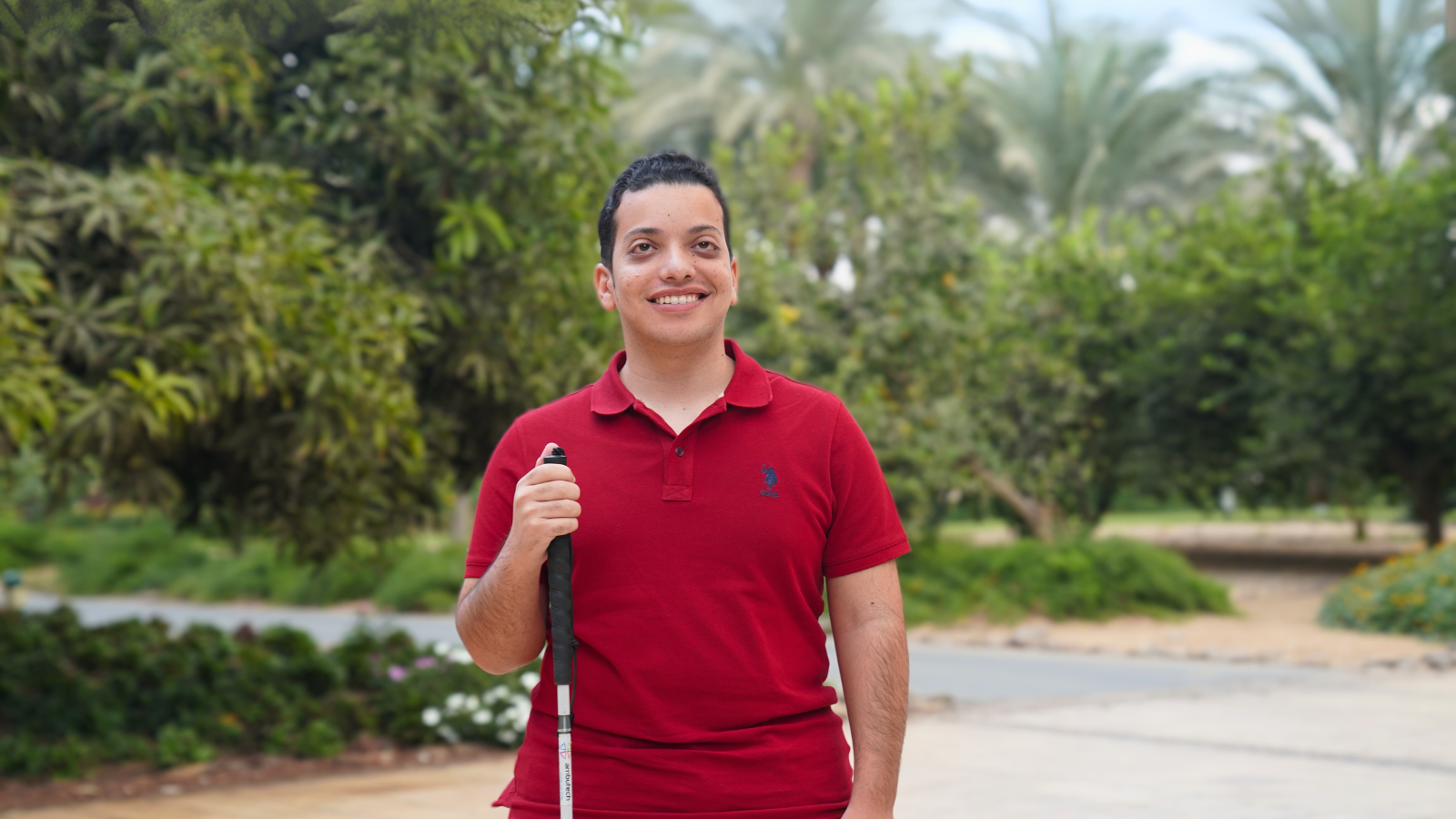 Mark Morad smiles in front of the AUC garden