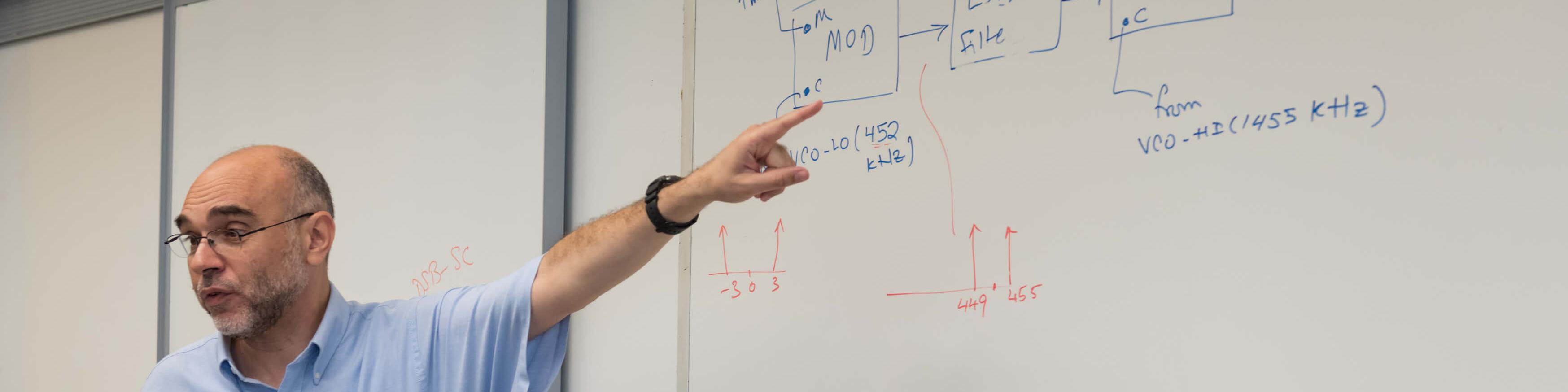 Professor writing on the white board