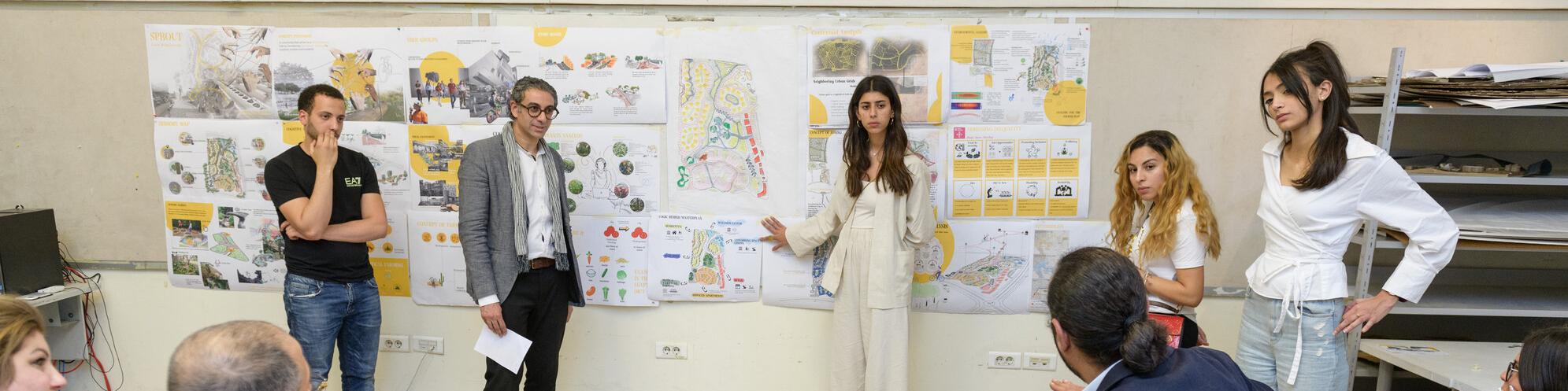 an architecture student presenting her work in front a jury 