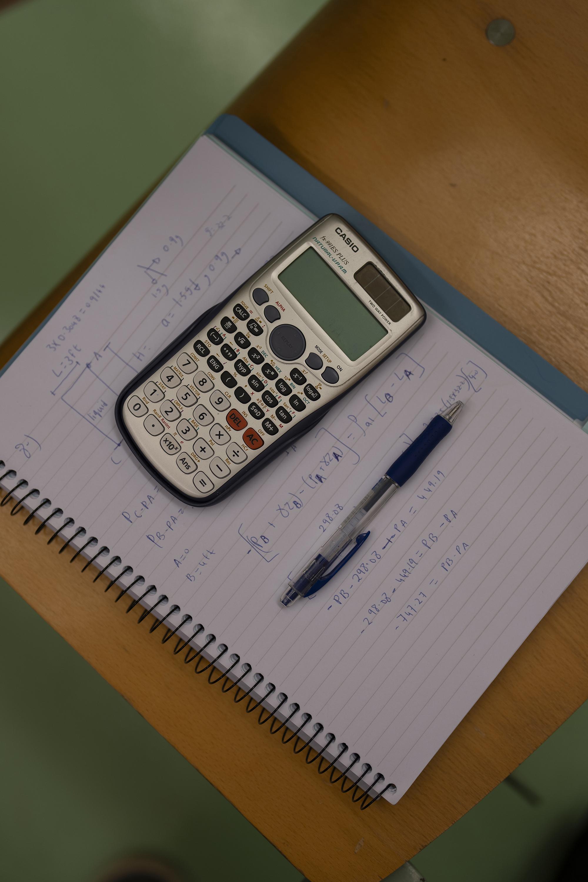 calculator and pen in class