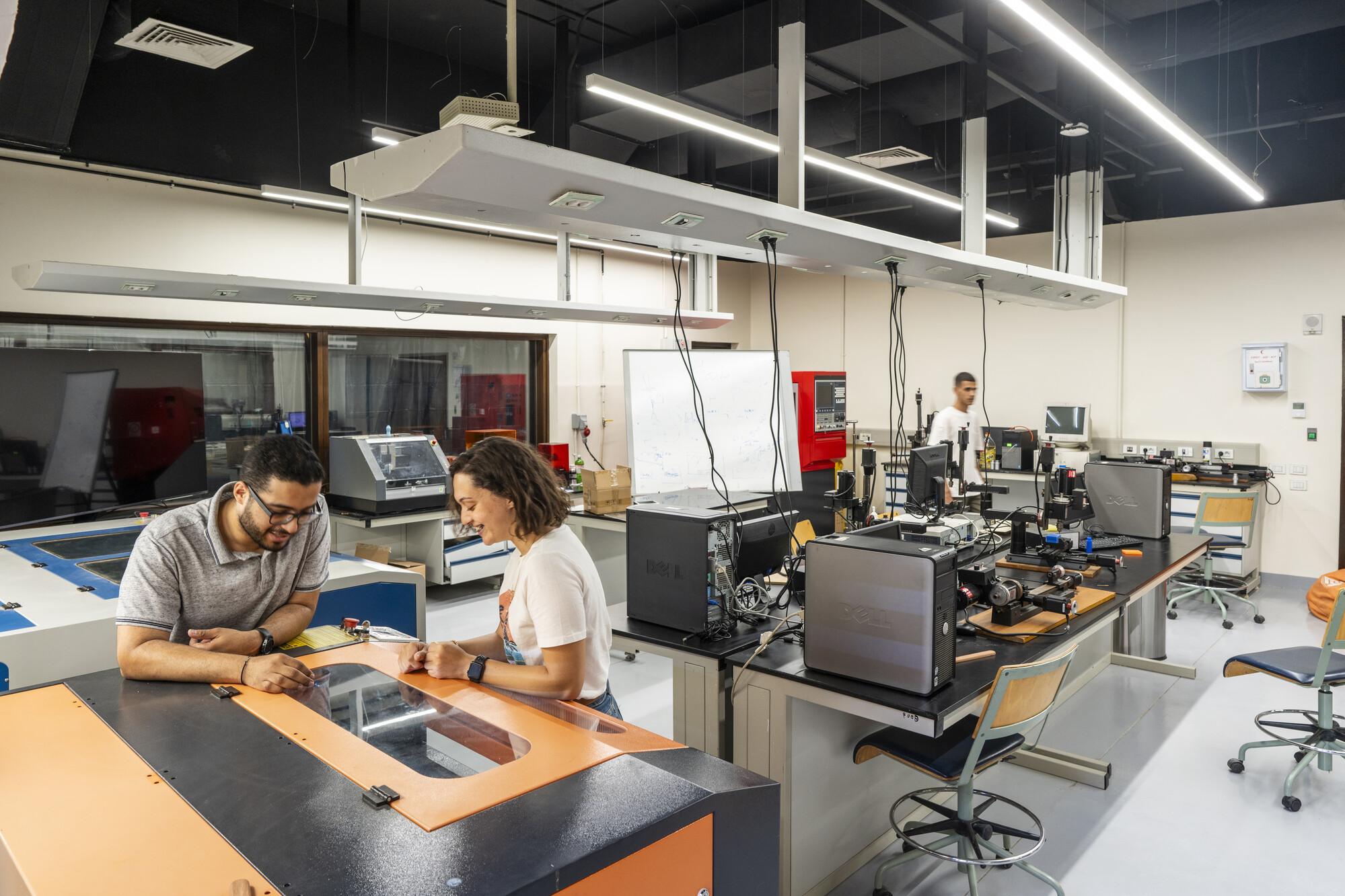 students in engineering lab working with equipment