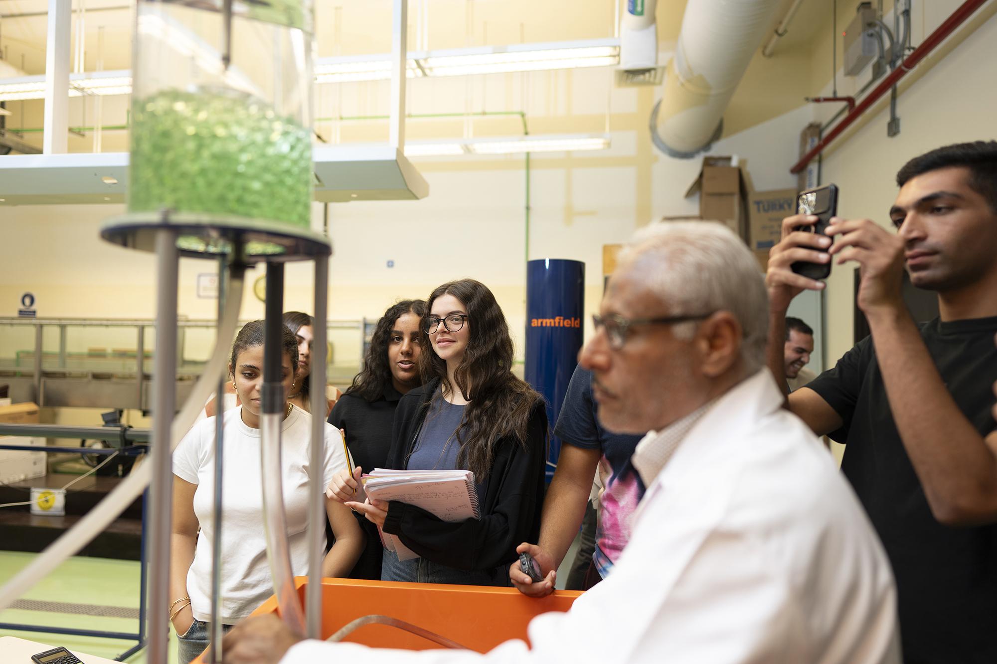 students in lab working with materials