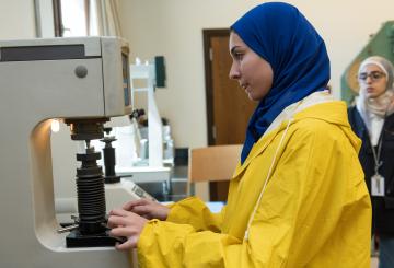 student in a mechanical engineering lab