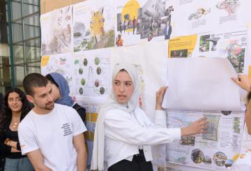 female student presenting her architecture project 