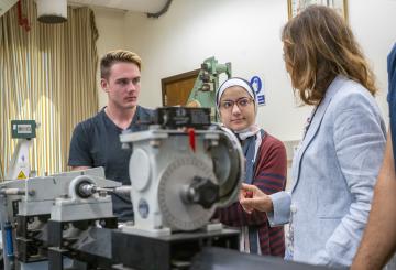 mechanical engineering equipment with students and faculty working with the machines