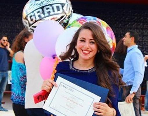 A girl posing for her graduation photo