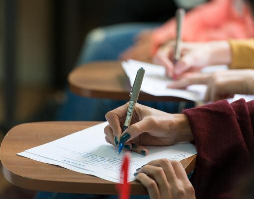 students writing in class