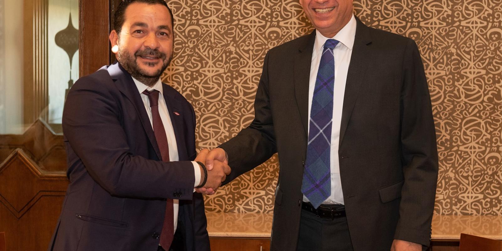 AUC Provost Ehab Abdel-Rahman and Dow Egypt's Country Manager Momen Adel sign the AUC-Dow research and development partnership