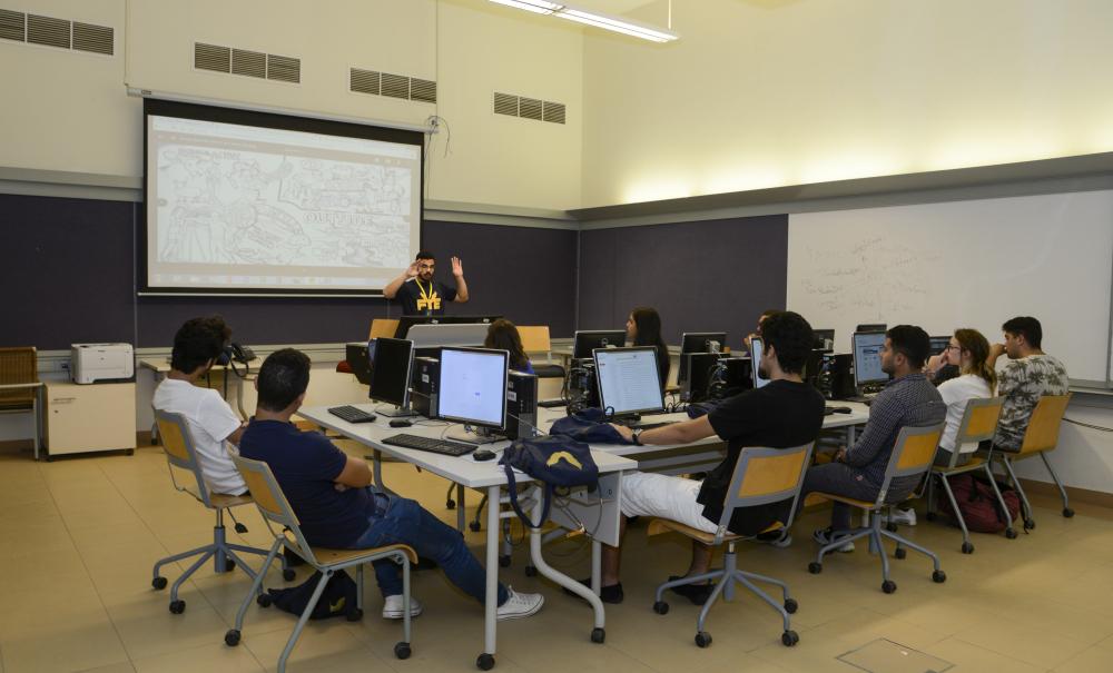 ESS Students in a class with computer screens