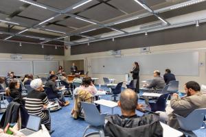 executives in classroom with a facilitator explaining for AFRETEC