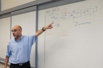 Professor writing on the white board