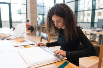 student studying in a library