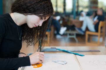 student making an architectural drawing