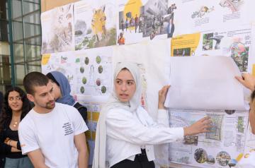 female student presenting her architecture project 
