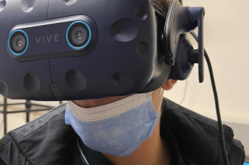 Student with VR equipment in architecture studio