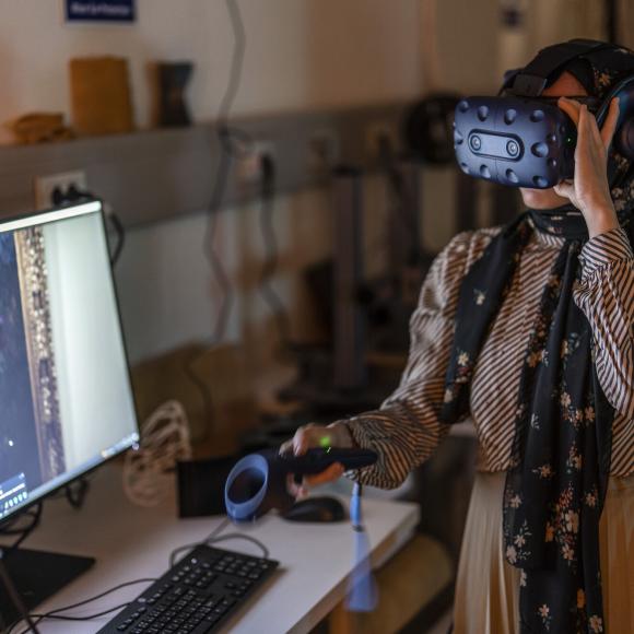 student using VR equipment for design class