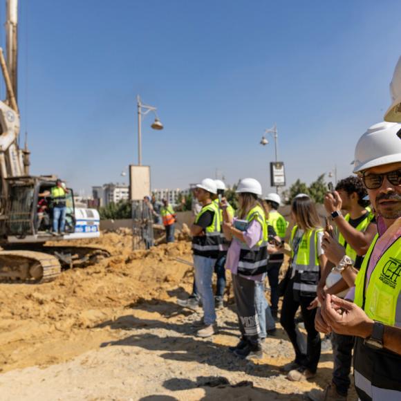 students on construction site working on project